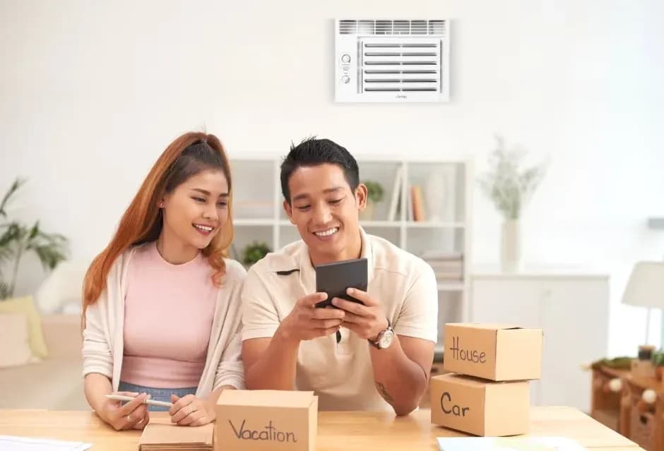 Homeowners reviewing their expenses and happy to see increased aircon energy savings with Carrier Optima