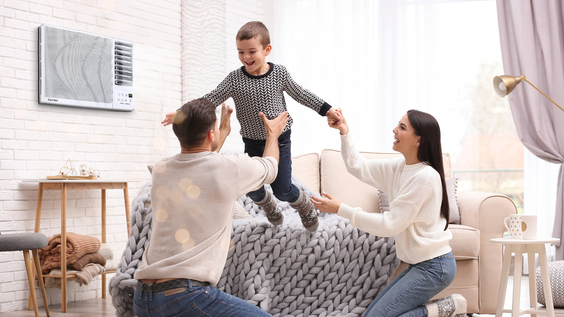 father-son-and-mother-having-a-family-bonding-in-a-living-room-with-aircon-carrier-philippines-blog