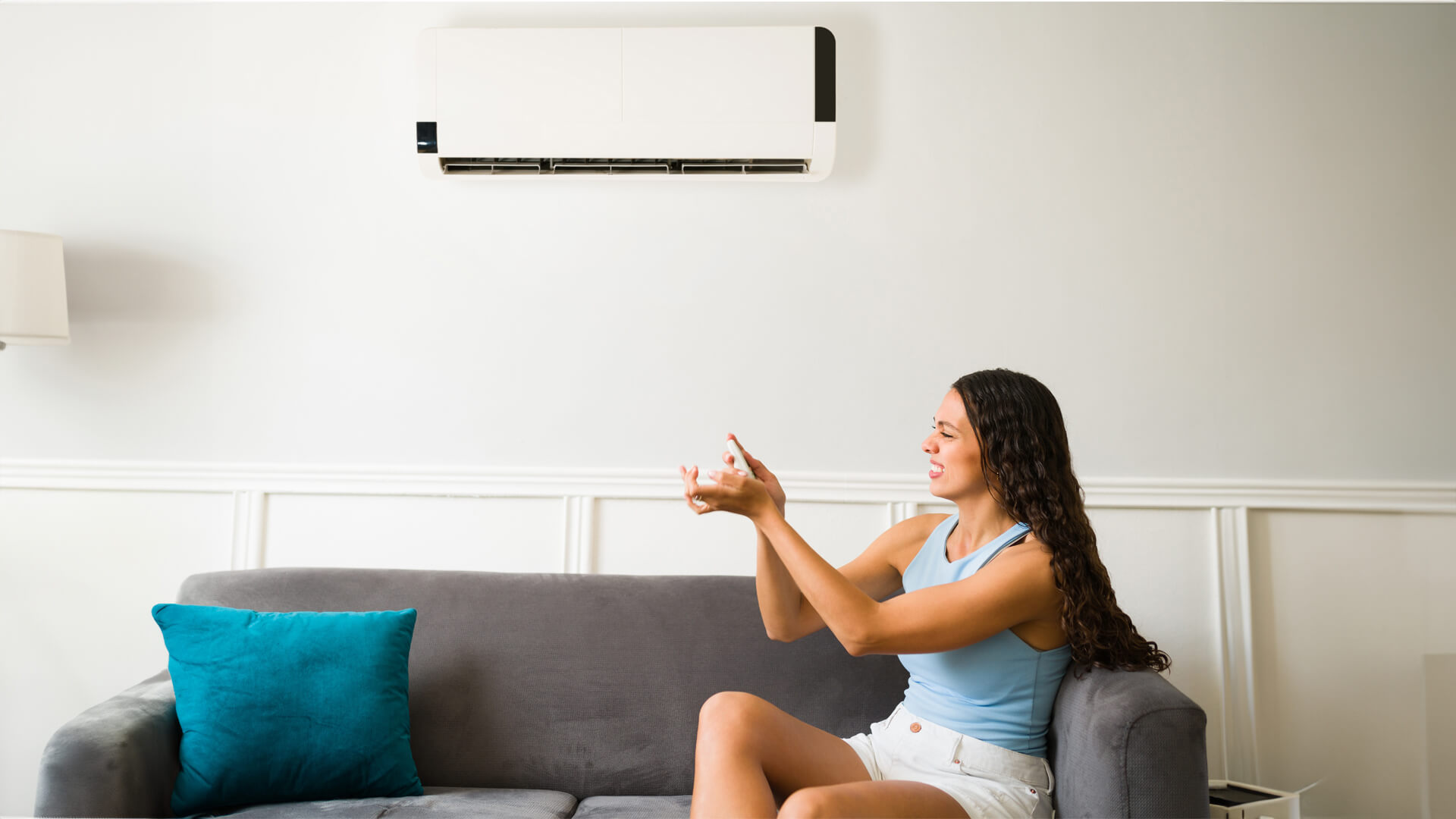 girl-trying-to-click-aircon-remote-to-increase-air-cooling-carrier-philippines-blog-banner-image